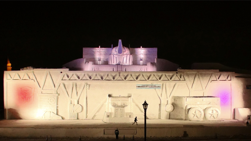 Illustration for article titled This Enormous Transformers Snow Sculpture Will Blow Your Mind